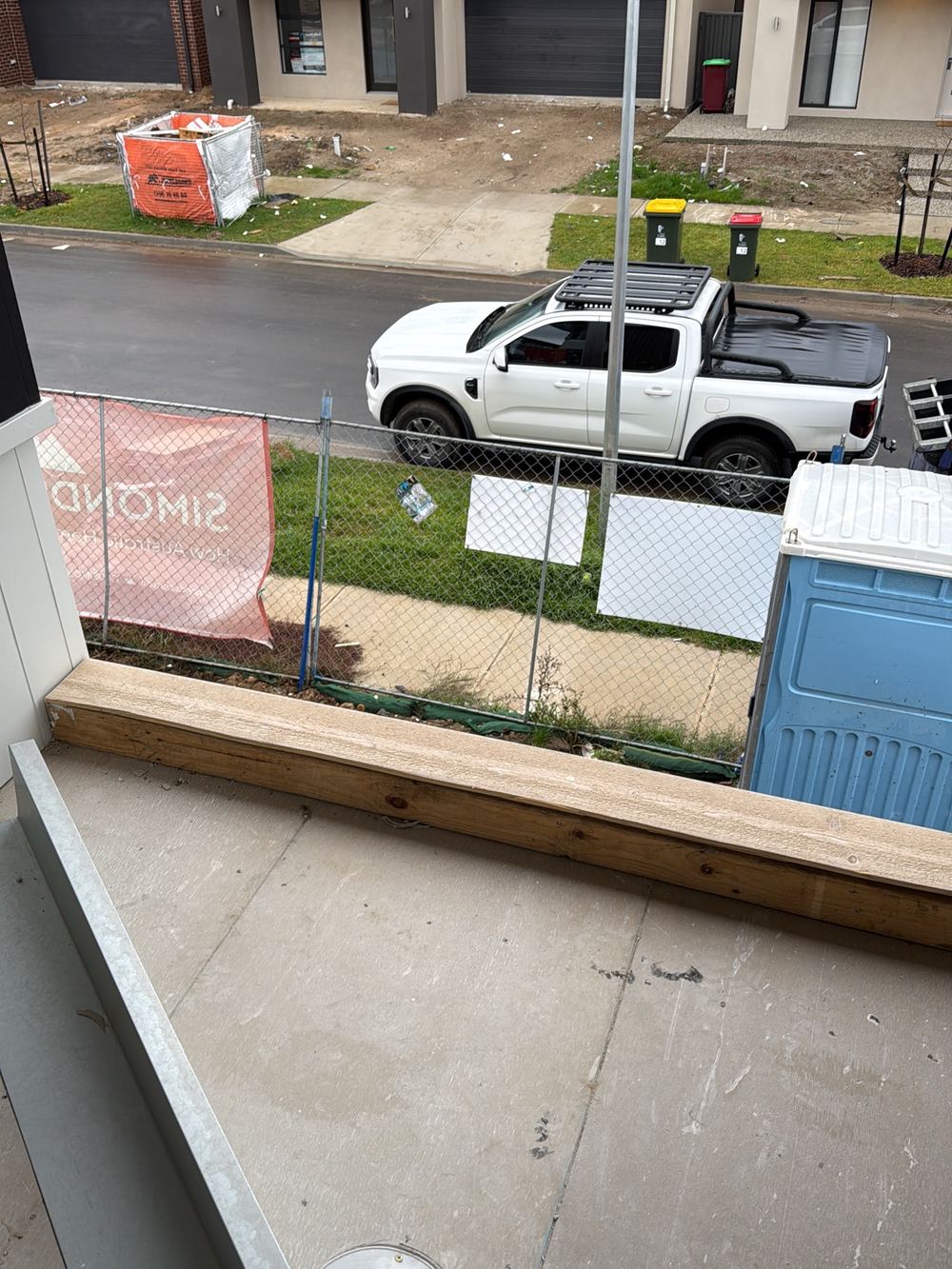 Balcony without handrails or any temporary edge protection, found during a fixing inspection in Berwick