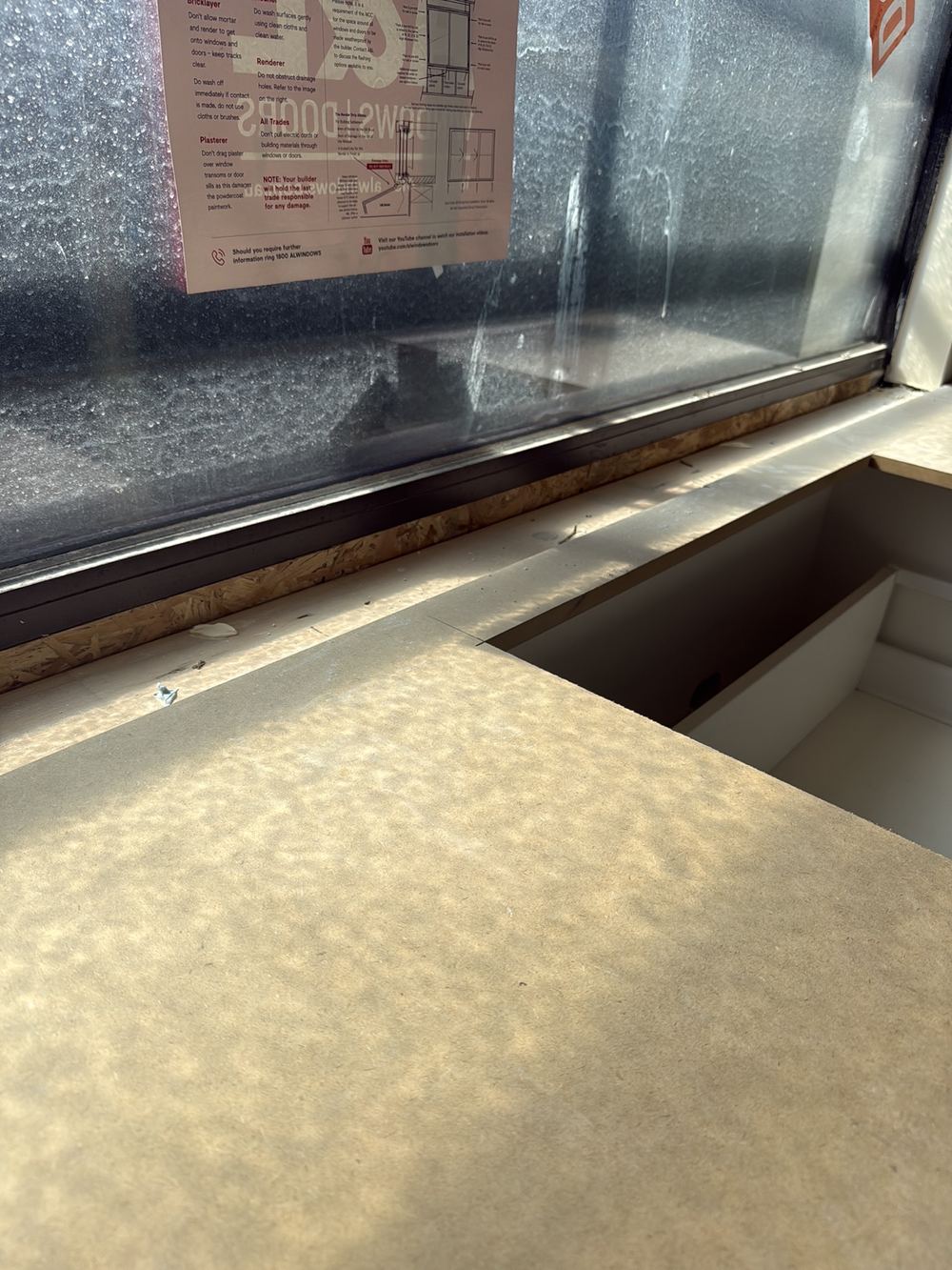 Kitchen window with nothing supporting its bottom edge, found during a fixing inspection in Berwick
