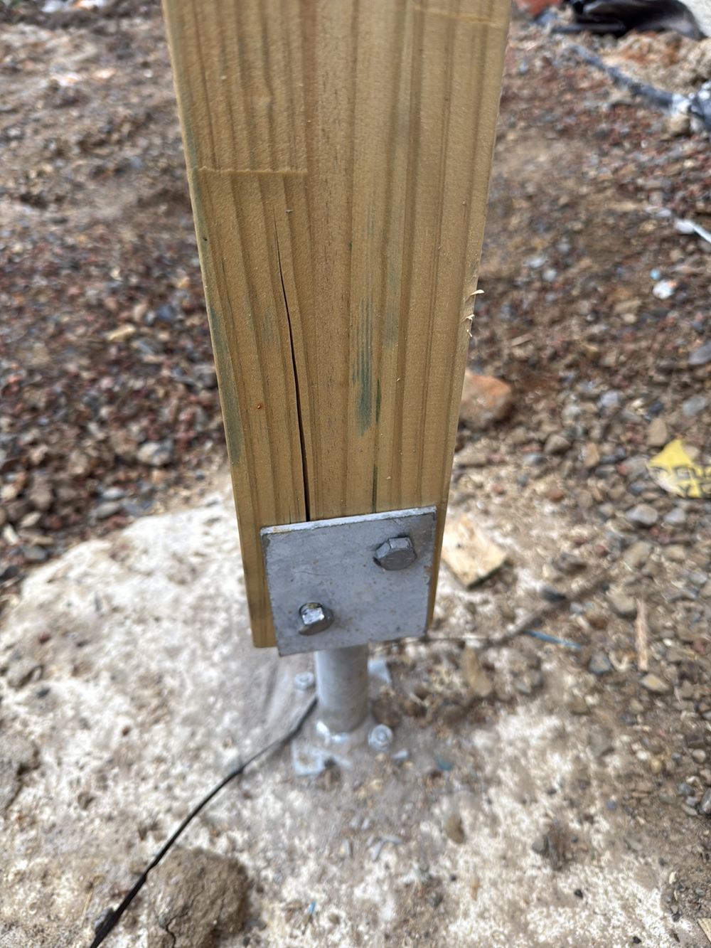 Timber post split open by coach screws driven in badly, Berwick