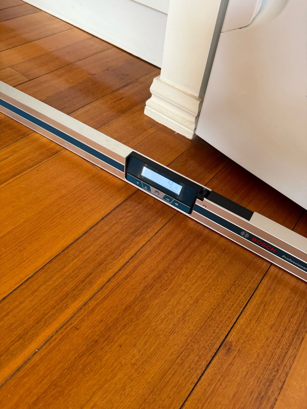 Level laid across the boards, showing the floor running out of level, Berwick