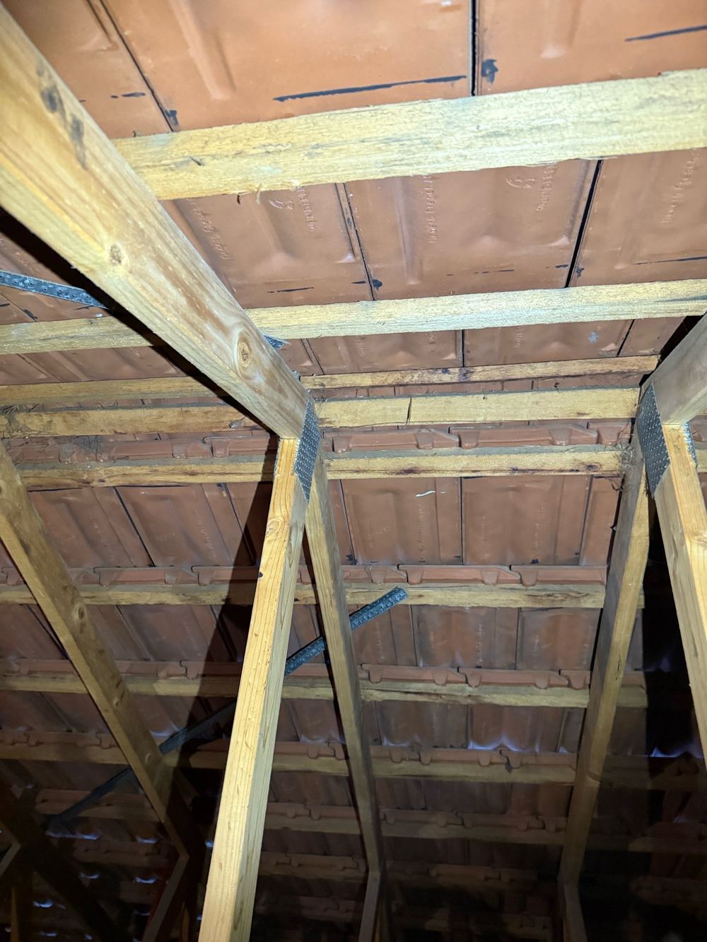 Roof bracing over the entry not bent over and nailed off as required, found during a pre-purchase inspection in Berwick