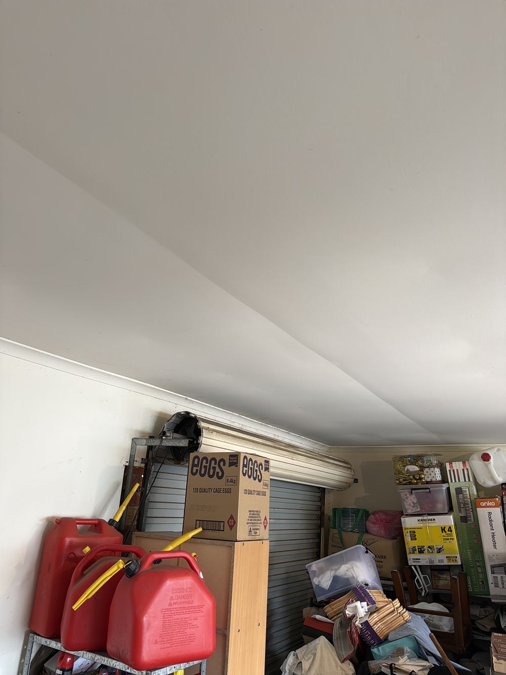 Undulating garage ceiling plaster, suggesting sheets starting to loosen, found during a pre-purchase inspection in Berwick
